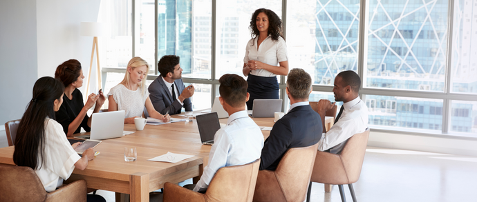 Board meeting in progress with each attendee having a board meeting agenda