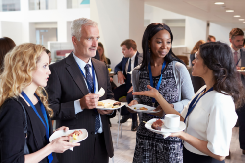 Chamber of commerce members networking at an event